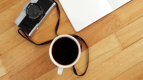 Camera-with-notepad-and-cup-of-coffee