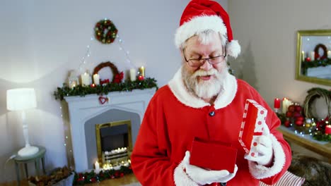Santa-claus-holding-a-gift-box