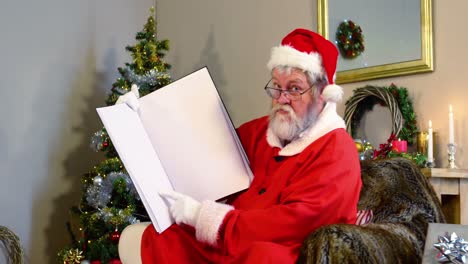 Santa-claus-holding-a-book