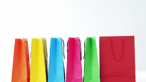 Multicolored-shopping-bags-on-white-background