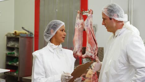 Team-of-butcher-interacting-with-each-other