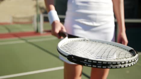 Sportswoman-practicing-tennis-on-a-sunny-day