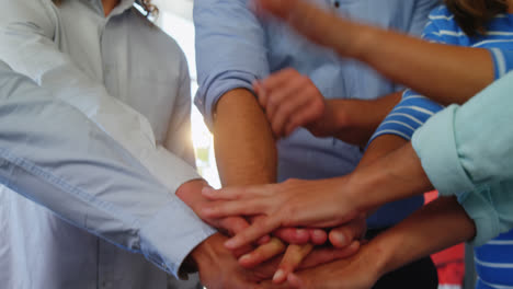 Group-of-happy-business-executives-with-hand-stack