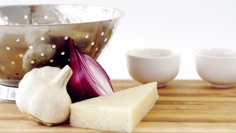 Cheese,-onion-and-garlic-with-colander
