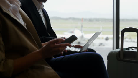 Passengers-using-laptop-and-mobile-phone