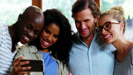 Group-of-friends-taking-selfie-from-mobile-phone