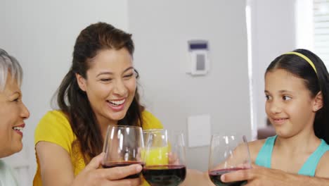Happy-family-toasting-wine-glasses