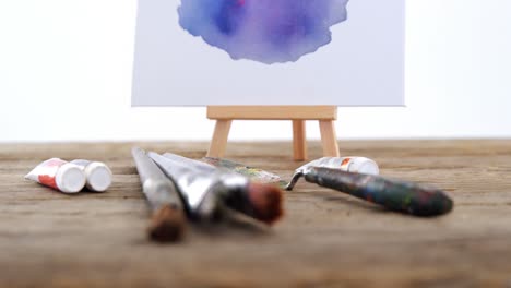 Watercolor-paint-on-white-canvas-with-various-paint-brushes