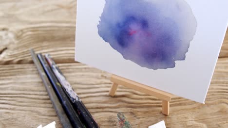 Watercolor-paint-on-white-canvas-with-various-paint-brushes
