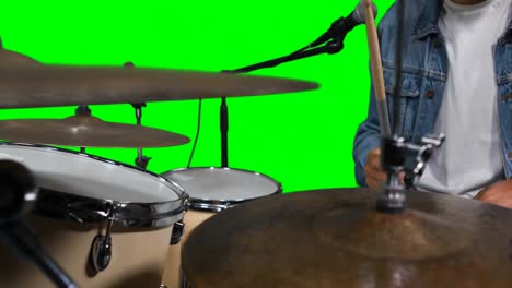 Mid-section-of-drummer-playing-drum