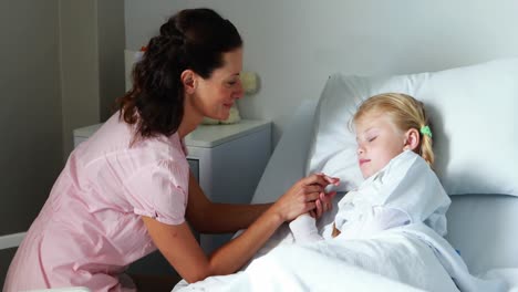 Mother-interacting-with-her-sick-daughter