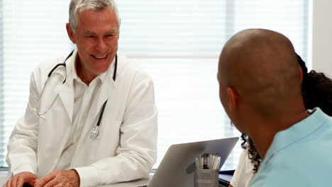 Male-doctor-and-patient-interacting-with-each-other