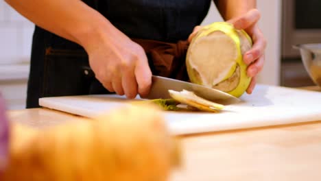 Chef-chopping-the-outer-skin-of-kohlrabi-vegetable