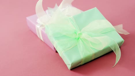 Gift-boxes-against-pink-background