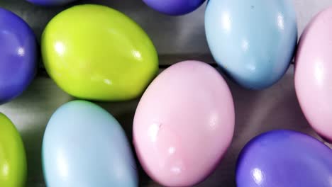 Multicolored-Easter-eggs-on-wooden-surface
