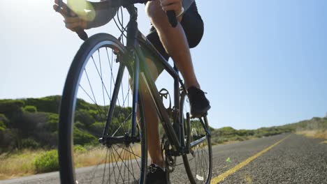 Triathlete-man-cycling-on-a-sunny-day