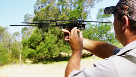 Man-aiming-with-crossbow