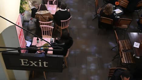 Exit-from-the-Cafe-in-Covent-Garden-here,-London,-United-Kingdom