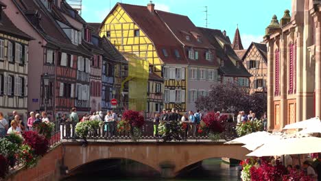 People-Stand-on-Stone-Bridge-in-Fishmongers-district-in-Colmar