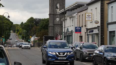 Static-View-of-Main-Street,-County-Mayo,-Ireland,-with-Traffic-Passing-Through