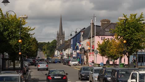 Wide-angle-shot-of-Claremorris-Main-Street,-County-Mayo-on-a-busy-day
