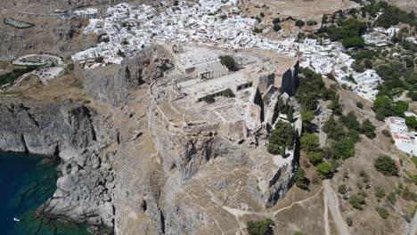Dynamic-drone-shot-of-the-Acropolis-of-Lindos-on-the-island-of-Rhodes,-Greece