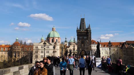 Tourists-visiting-the-Charles-Bridge-in-Prague,-Czech-Republic