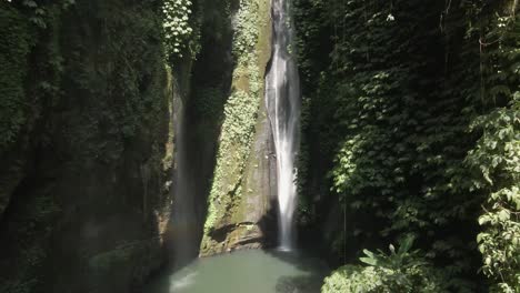 Aerial-pulls-in-to-Sekumpul-waterfall-in-vertical-grotto-in-Bali