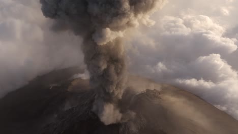 Volcano-explosion-ash-cloud-rising-from-crater-in-mushroom-shape,-aerial