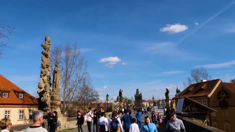 Tourists-visiting-Charles-Bridge-in-Prague,-Czech-Republic