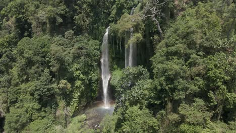Wispy-Sekumpul-waterfall-flows-from-lush-Bali-jungle-foliage-on-cliff