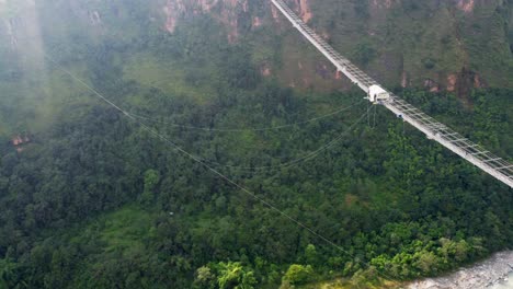 Aerial-top-down-shot-of-bridge-with-bungee-jumping-in-jungle-of-Nepal