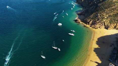 Aerial-view-of-boats-on-the-coastline-of-Cabo-San-Lucas,-sunny-day-in-Mexico