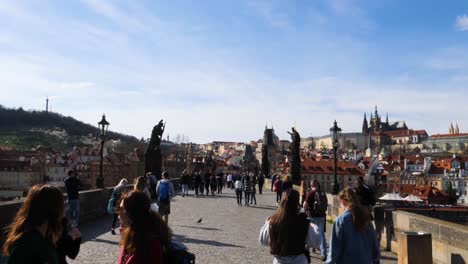 Tourists-walking-on-the-Charles-Bridge,-Prague,-Czech-Republic