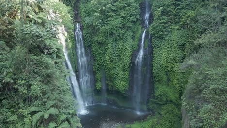 Three-falls-waterfall-flows-down-steep-jungle-cliff,-Sekumpul-Bali