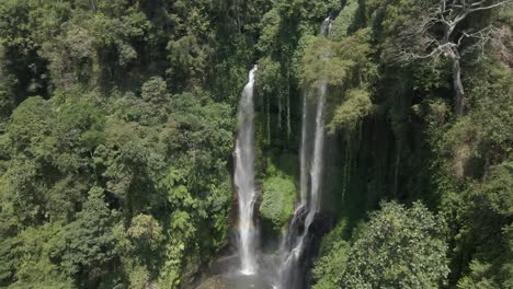 Aerial:-Subtle-rainbow-at-base-of-Bali-jungle-Sekumpul-waterfall