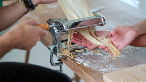 Homemade-Rolling-Dough-into-Pasta-Strands:-Cranking-Out-Fresh-Noodles