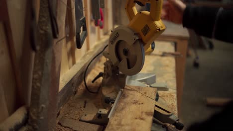 A-Man-is-Employing-a-Circular-Saw-to-Make-Cuts-in-the-Lumber-in-Indre-Fosen,-Trondelag-County,-Norway---Close-Up