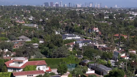 Neighborhood-aerial-flyover-Santa-Monica-with-Century-City-buildings-in-a-distance