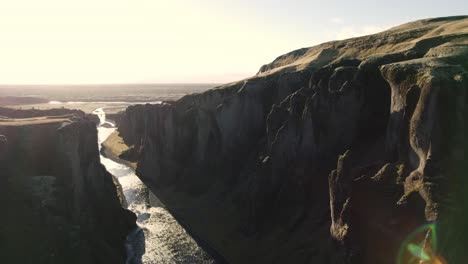 Cinematic-aerial-dolly-inside-famous-river-canyon-in-Iceland,-sunrise