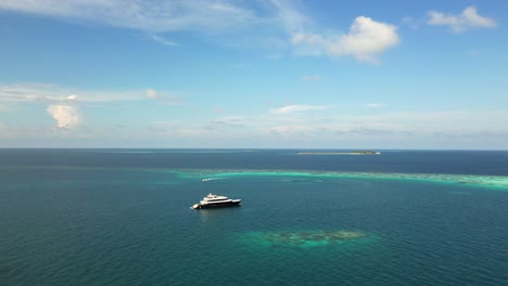 Aerial-view-of-live-aboard-dive-boats-moored-at-Fasdhoo-Lagoon-reef,-Manta-night-spot,-Maldives,-Indian-Ocean
