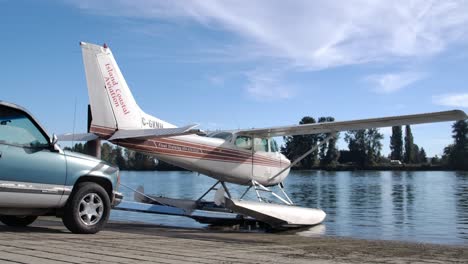 Launching-Floatplane-On-Wooden-Ramp-In-Vancouver,-BC,-Canada