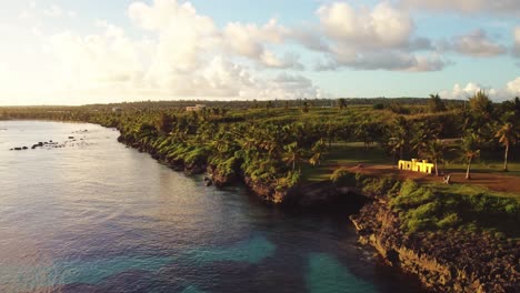 Drone-shot-of-Taga-beach-at-Tinian-island-during-a-golden-hour