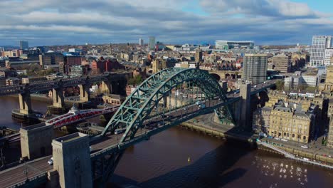 Aerial-drone-video-of-Tyne-Bridge-and-Swing-Bridge-on-Newcastle-Quayside-and-city-in-the-background---Newcastle-Upon-Tyne,-England