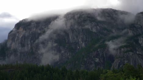 Stawamus-Chief-Mountain-Through-Fog-Clouds-In-British-Columbia,-Canada