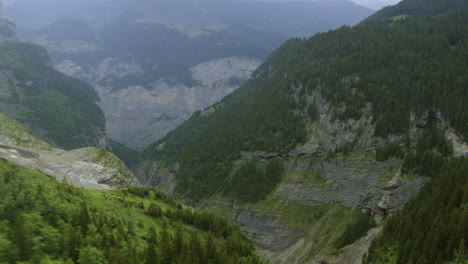 Beautiful-Waterfalls-in-Lauterbrunnen-Mountain-Cliffs-of-Switzerland,-Aerial-Flight