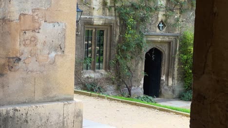 Old-Built-Structure-With-Cross-Above-Doorway-In-Worcester-College,-Oxford,-UK