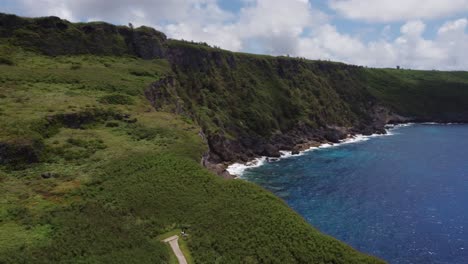 Orbit-shot-of-a-coastline-at-Tinian,-Northern-Mariana-Islands