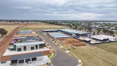 Yarrawonga,-Victoria,-Australia---7-December-2023:-Aerial-view-over-new-industrial-site-and-showing-the-Yarrawonga-Bunnings-hardware-store-and-Lake-Mulwala-beyond