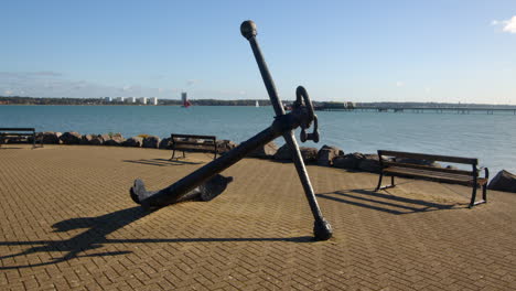 wide-shot-of-an-old-anchor-at-Hythe-Marina-village-with-Weston-in-background